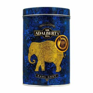 Ekspresowe herbaty Earl Grey od Sir Adalbert’s Tea w eleganckim metalowym opakowaniu z złotym słoniem. Idealne do aromatycznej filiżanki czarnej herbaty premium.