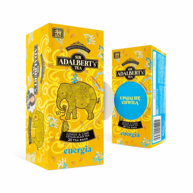 Herbata ADALBERT'S TEA LEMON & LIME ENERGIA - SASZETKI 2 Ekologiczne herbaty czarne Sir Adalbert's z cytryną i limonką, 20 torebek, opakowanie w kolorze żółtym z eleganckim słoniem na froncie, idealne do relaksu i energii.